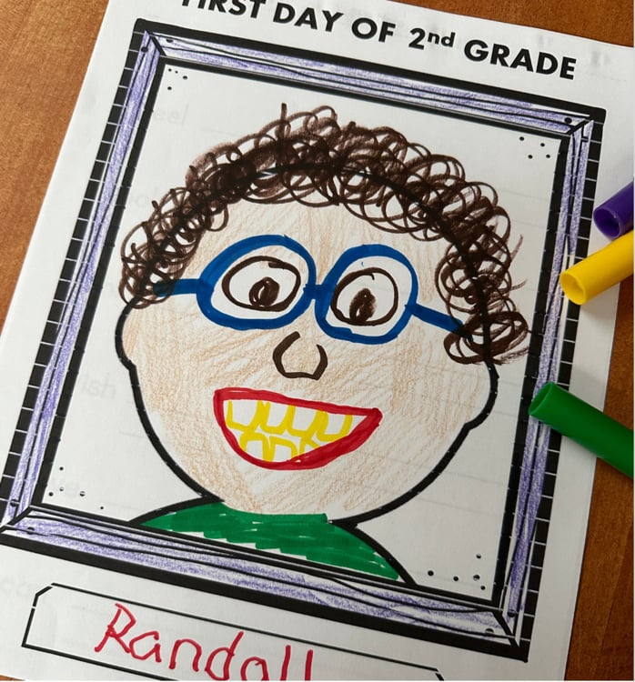 First day of 2nd grade self-portrait drawing by Randall with blue glasses and curly hair ffdb4d3c